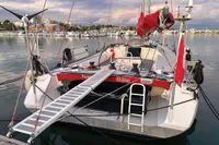 Finot Open 50 sailboat, 2005 model, docked at a marina with a boarding ramp.