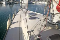 Deck view of 2005 Finot Open 50 sailboat docked in a marina.