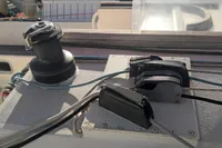 Winch and cleats on 2005 Finot Open 50 sailboat deck.