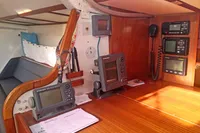 Navigation equipment inside a 2005 Finot Open 50 yacht, featuring control panels and communication devices.