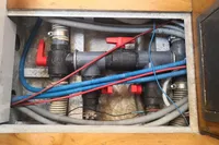 Plumbing system of a 2005 Finot Open 50 sailboat, featuring pipes and valves.