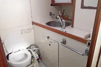 Compact boat bathroom with toilet and sink, Finot Open 50, 2005 model.