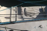 Deck of 2005 Finot Open 50 sailboat with ropes and fittings.