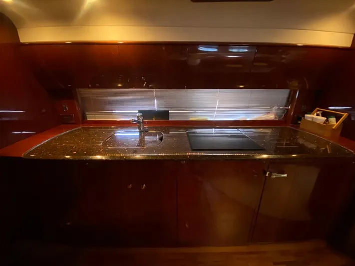  Yacht Photos Pics Luxurious kitchen area in a 2006 Viking Princess V 58 yacht with sleek countertops.