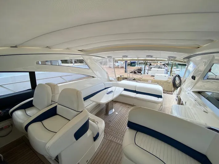  Yacht Photos Pics Luxurious interior of 2006 Viking Princess V 58 yacht with white and blue seating.