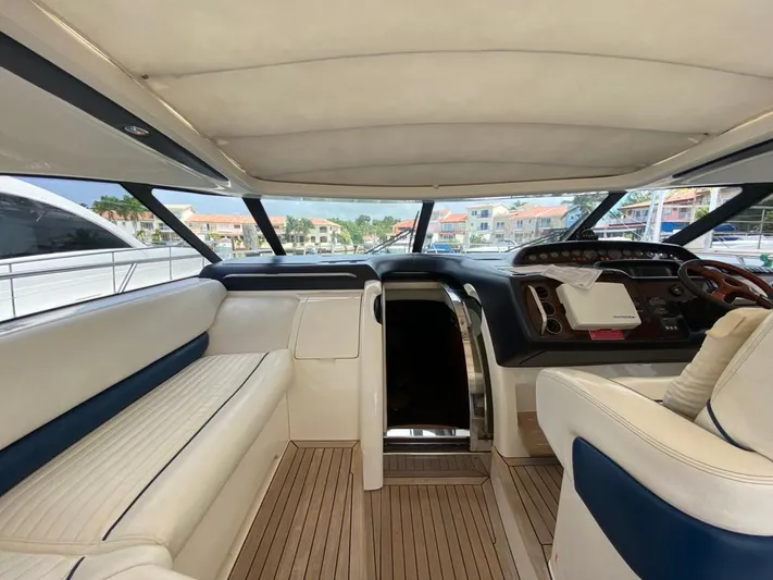  Yacht Photos Pics Interior of 2006 Viking Princess V 58 yacht with luxurious seating and modern dashboard.