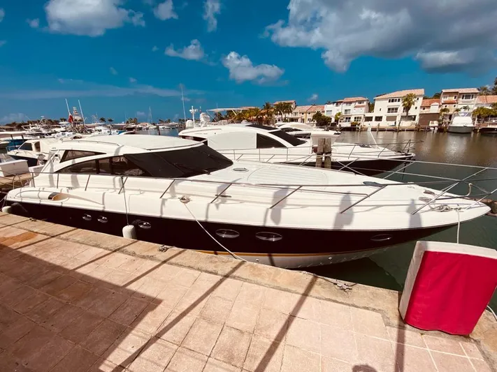  Yacht Photos Pics Luxury Viking Princess V 58 yacht docked at marina, 2006 model, under clear blue sky.