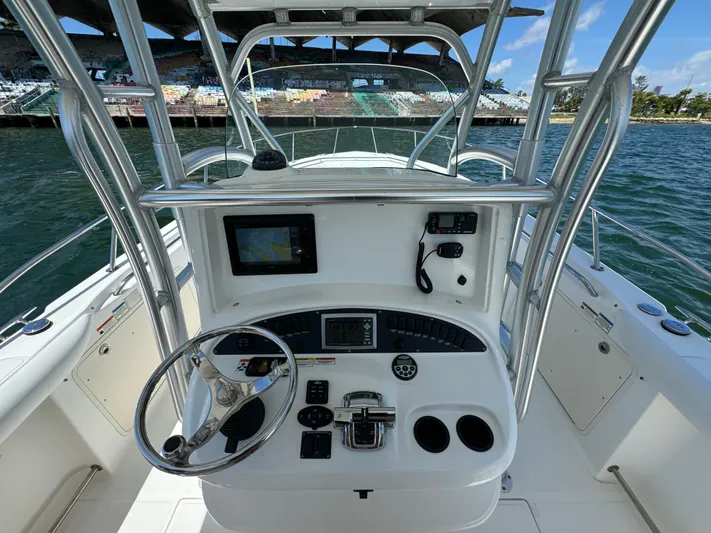  Yacht Photos Pics 2008 Boston Whaler 320 Outrage boat helm with navigation equipment and controls.