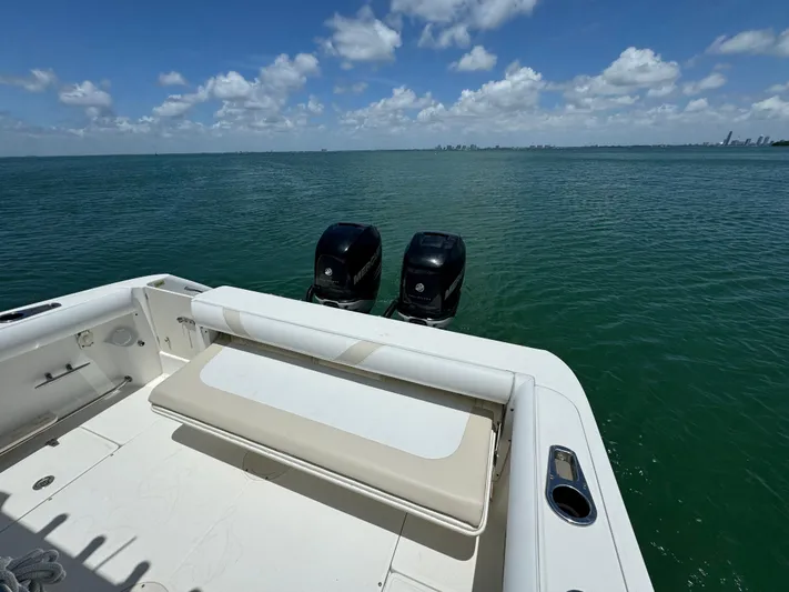  Yacht Photos Pics 2008 Boston Whaler 320 Outrage boat with twin outboard motors on open water.