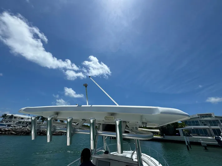  Yacht Photos Pics Boston Whaler 320 Outrage 2008 boat docked under clear blue sky.