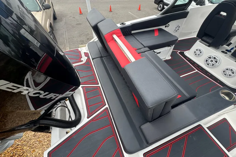  Yacht Photos Pics 2025 Monterey Elite 27 OB boat interior with black and red seating, Mercury engine visible.