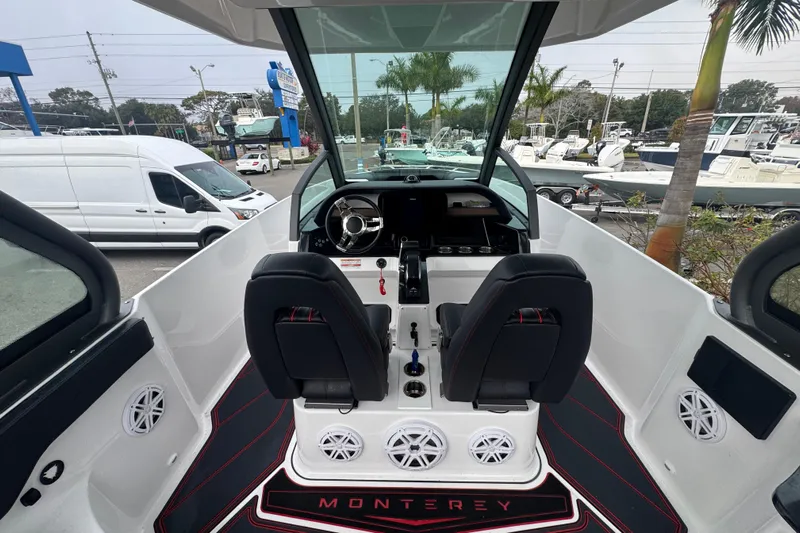  Yacht Photos Pics Interior view of 2025 Monterey Elite 27 OB boat, featuring dual seats and modern dashboard.