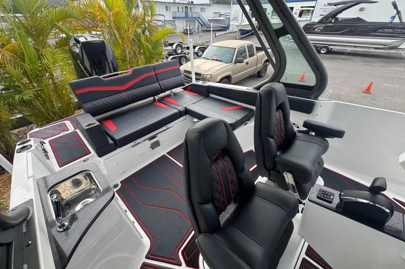  Yacht Photos Pics 2025 Monterey Elite 27 OB boat interior with black and red seating, modern design.