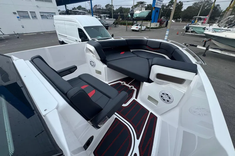  Yacht Photos Pics 2025 Monterey Elite 27 OB boat interior with sleek black and red seating and modern design.