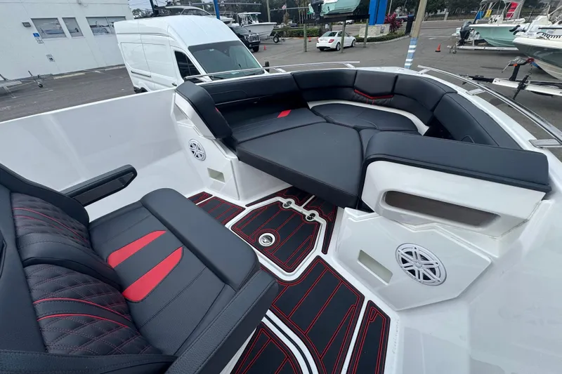  Yacht Photos Pics Luxurious seating on 2025 Monterey Elite 27 OB boat with stylish black and red accents.