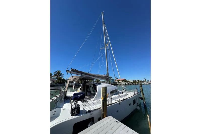 Betty Mae Yacht Photos Pics 2006 Lagoon 380 catamaran docked under clear blue sky.