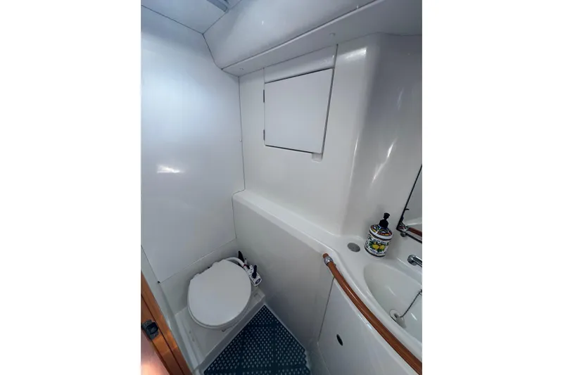 Betty Mae Yacht Photos Pics Compact bathroom in 2006 Lagoon 380 catamaran with toilet and sink.