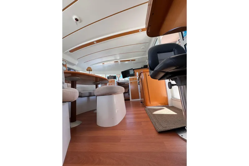 Betty Mae Yacht Photos Pics Interior of 2006 Lagoon 380 catamaran with modern seating and wooden flooring.