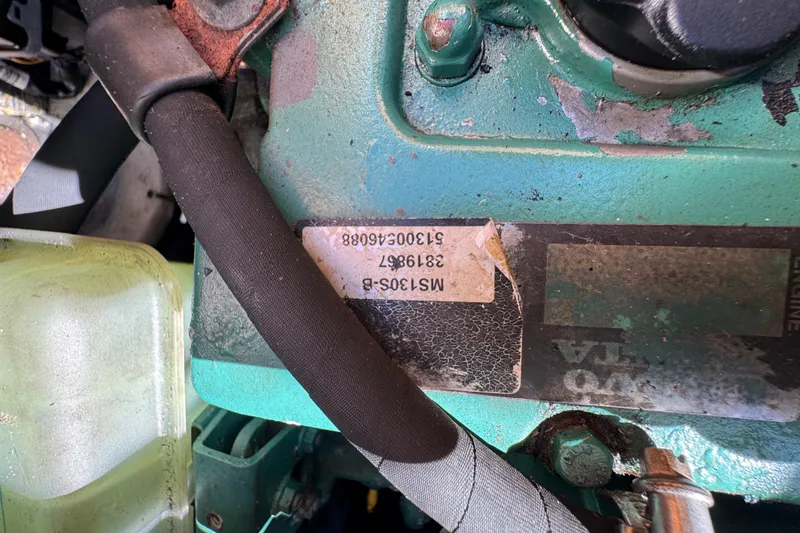 Betty Mae Yacht Photos Pics Close-up of a 2006 Lagoon 380 engine component with visible serial numbers.