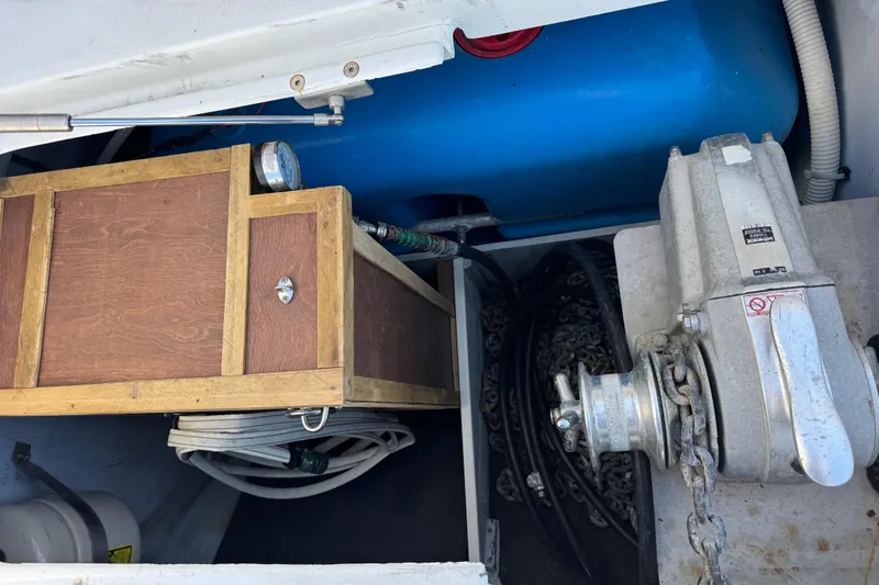 Betty Mae Yacht Photos Pics Storage compartment of a 2006 Lagoon 380 catamaran with equipment and chains.