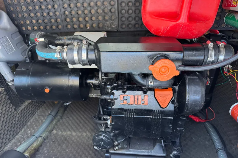 Betty Mae Yacht Photos Pics Engine compartment of a 2006 Lagoon 380 catamaran, featuring a Focs engine.