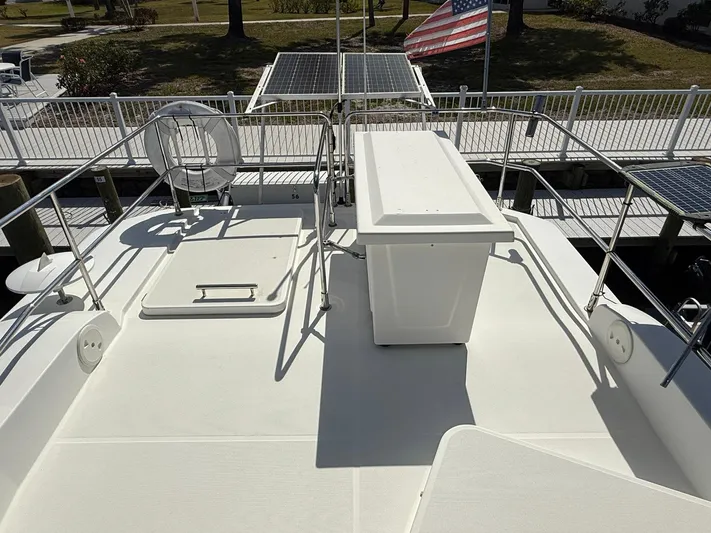 Seven Grand Yacht Photos Pics 2016 Beneteau Swift Trawler 30 deck with solar panels and American flag.