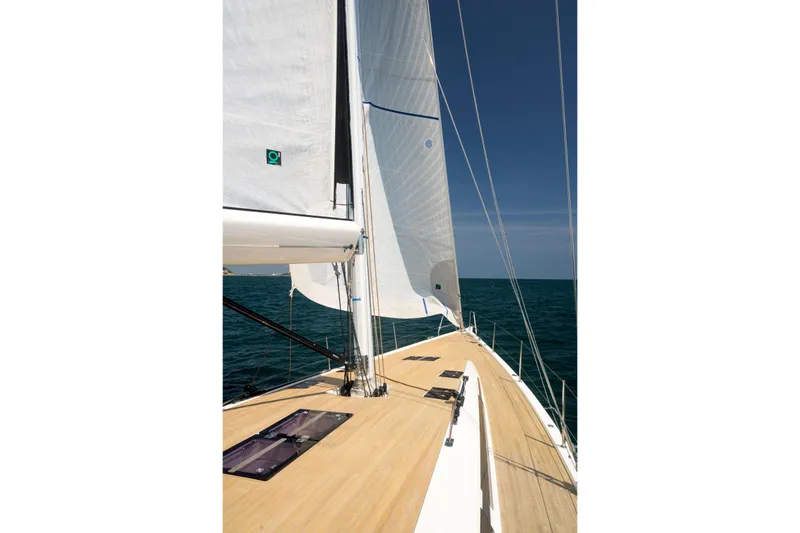 Invictus Yacht Photos Pics 2023 Nautor Swan 55 sailing yacht on open sea, showcasing sleek deck and sails.