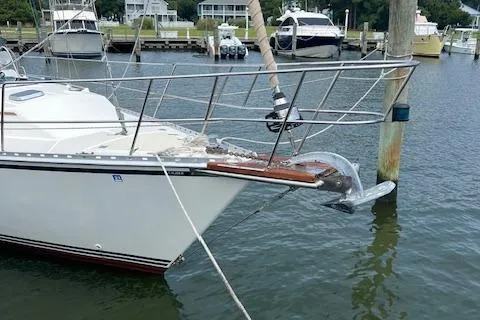 2003 Caliber 40LRC sailboat docked in a marina with other boats.