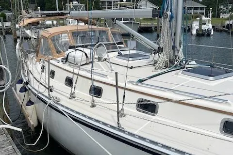 Agandau Yacht Photos Pics 2003 Caliber 40LRC sailboat docked at a marina, featuring a sleek design and spacious deck.