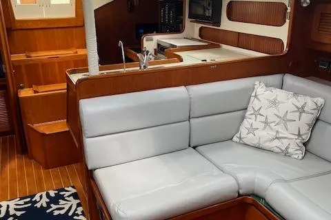 Agandau Yacht Photos Pics Interior of 2003 Caliber 40LRC yacht with cozy seating and nautical decor.