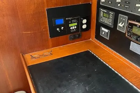 Agandau Yacht Photos Pics Control panel of a 2003 Caliber 40LRC sailboat with wooden finish and navigation equipment.