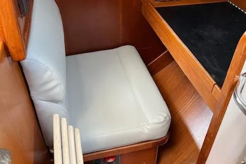 Agandau Yacht Photos Pics 2003 Caliber 40LRC interior with cushioned seating and wooden desk.