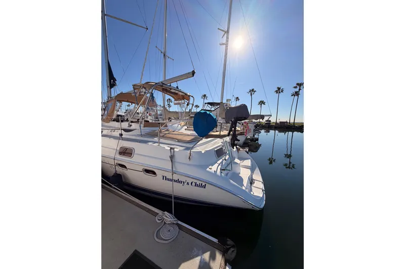 Thursday's Child Yacht Photos Pics Sailboat "Thursday's Child" docked, Hunter Passage 456, 2005 model, sunny marina setting.