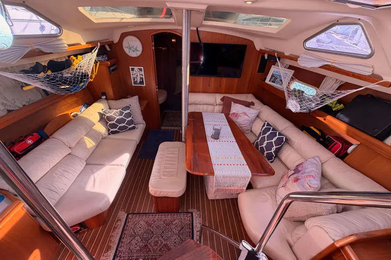 Thursday's Child Yacht Photos Pics Luxurious interior of 2005 Hunter Passage 456 yacht with cozy seating and elegant decor.