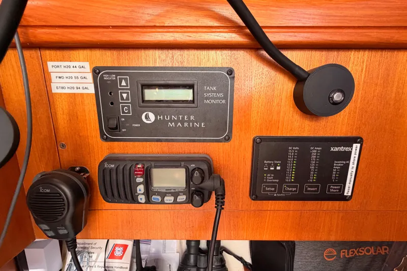 Thursday's Child Yacht Photos Pics Control panel of a 2005 Hunter Passage 456 yacht with marine systems and radio.