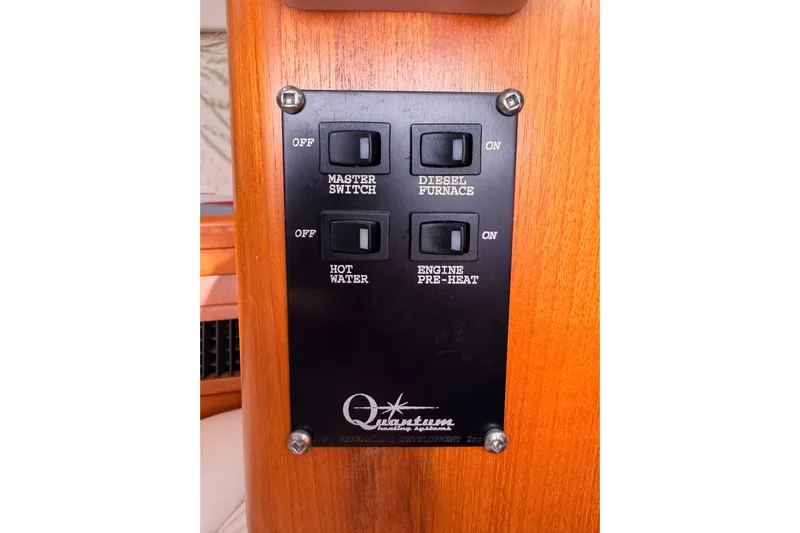 Thursday's Child Yacht Photos Pics Control panel on a 2005 Hunter Passage 456 yacht with switches for various functions.