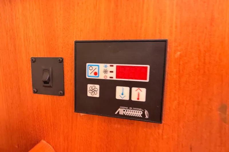 Thursday's Child Yacht Photos Pics Control panel on a 2005 Hunter Passage 456 yacht interior.