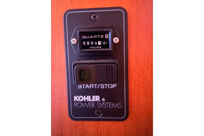 Thursday's Child Yacht Photos Pics Kohler power system panel with hour meter on Hunter Passage 456, 2005 model.