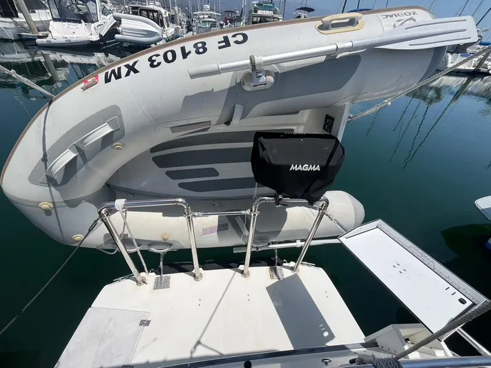 Ben Yacht Photos Pics Ranger Tugs R-27 (2011) with dinghy and Magma grill at marina.