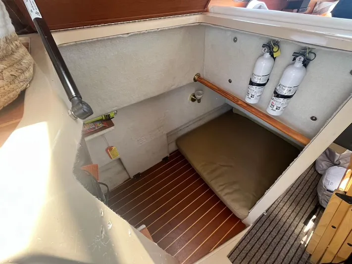 Ben Yacht Photos Pics 2011 Ranger Tugs R-27 interior with fire extinguishers and storage area.