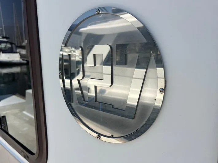 Ben Yacht Photos Pics 2011 Ranger Tugs R-27 emblem on boat exterior.