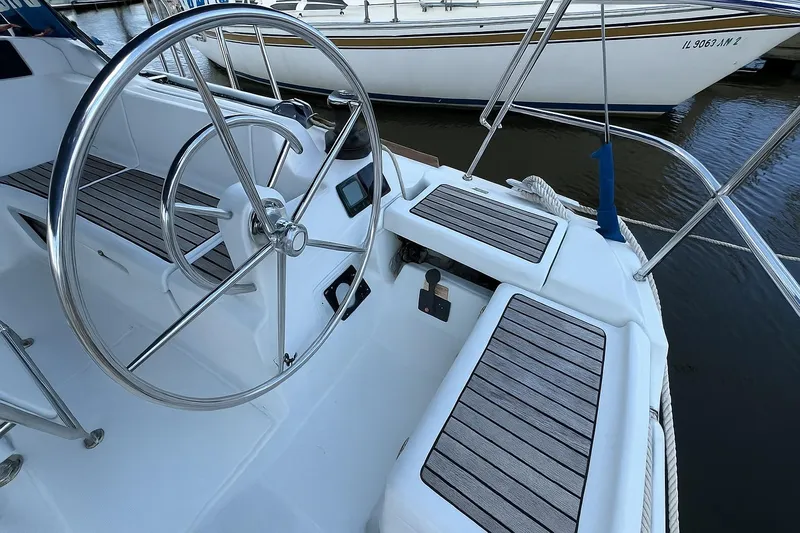 Corrine Yacht Photos Pics Steering wheel and seating area of a 2015 Jeanneau 409 sailboat.