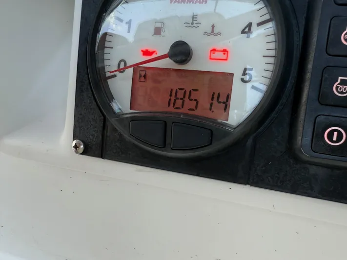 Corrine Yacht Photos Pics Instrument panel of a 2015 Jeanneau 409 sailboat showing engine hours and warning lights.