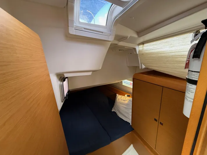 Corrine Yacht Photos Pics Cozy cabin interior of 2015 Jeanneau 409 sailboat with bed and storage.
