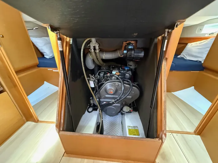 Corrine Yacht Photos Pics Engine compartment of a 2015 Jeanneau 409 sailboat, showcasing mechanical components.