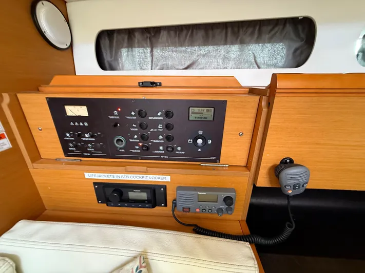 Corrine Yacht Photos Pics Control panel inside a 2015 Jeanneau 409 sailboat, featuring navigation and communication equipment.