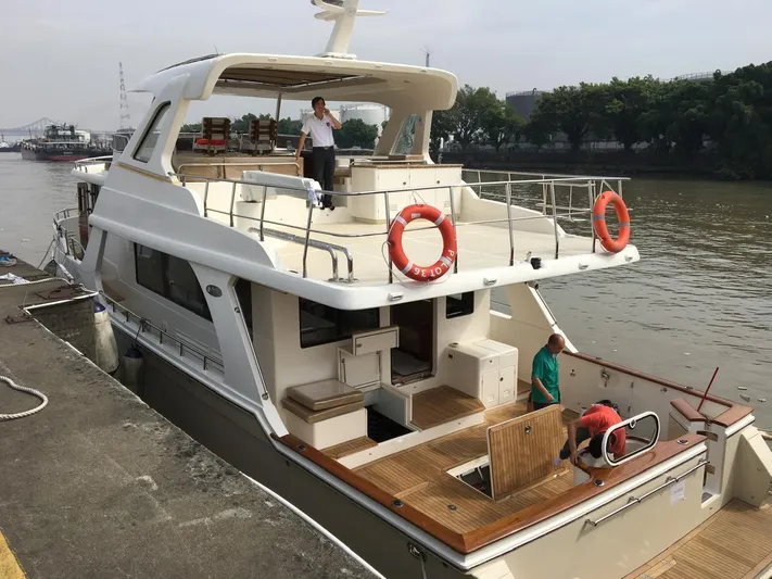  Yacht Photos Pics Luxury Selene 59 Ocean Clipper yacht docked, featuring spacious deck and modern design, 2015 model.