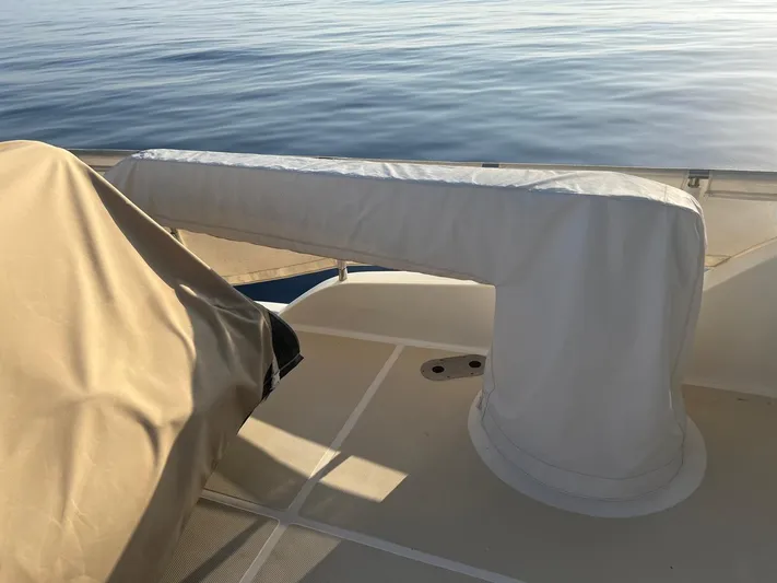  Yacht Photos Pics 2015 Selene 59 Ocean Clipper deck with covered equipment, calm sea in background.