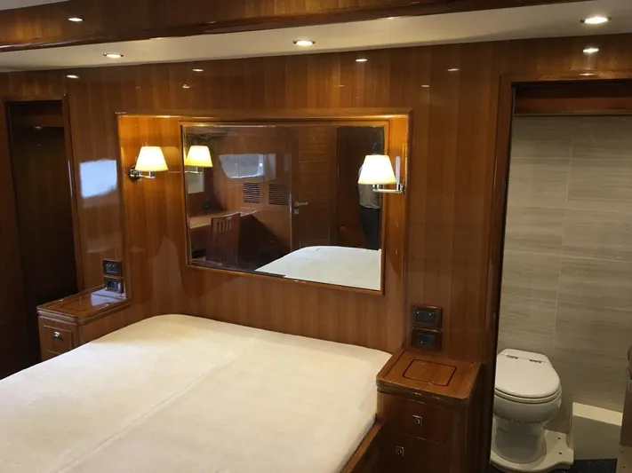  Yacht Photos Pics Luxurious cabin interior of 2015 Selene 59 Ocean Clipper yacht with wood paneling and ensuite bathroom.