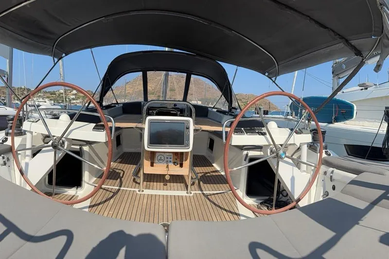 Bobbi Dazzler Yacht Photos Pics 2013 Jeanneau 57 yacht cockpit with dual steering wheels and navigation equipment.